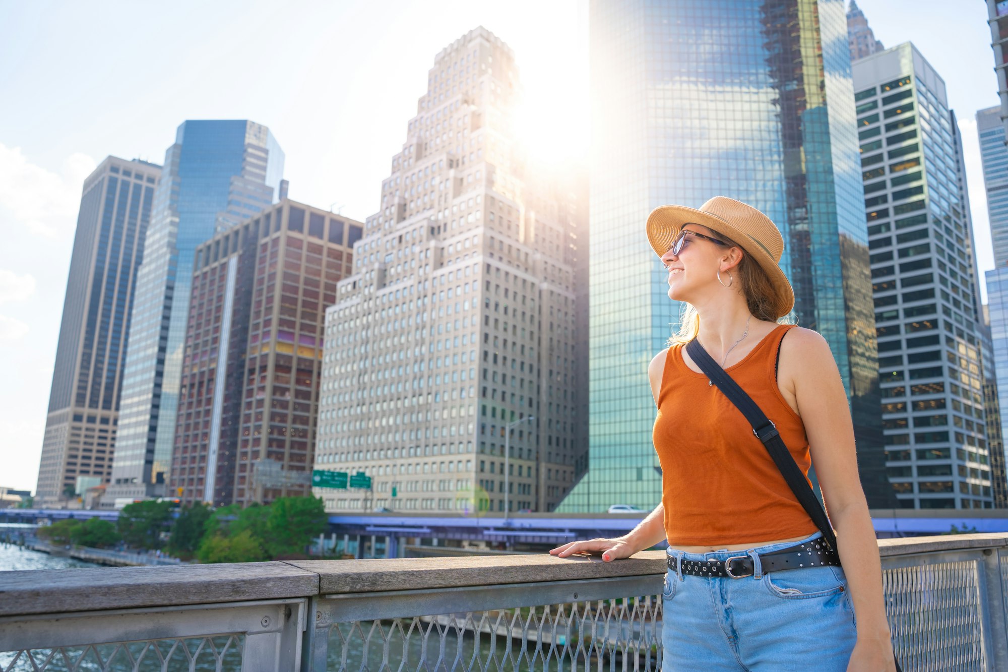 Young woman with hat happy traveling in New York.